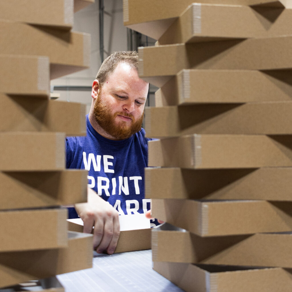 A man constructs a custom box